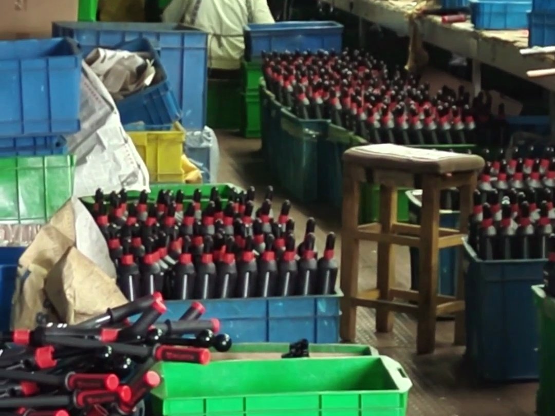Finished rivet guns stacked at the end of the line